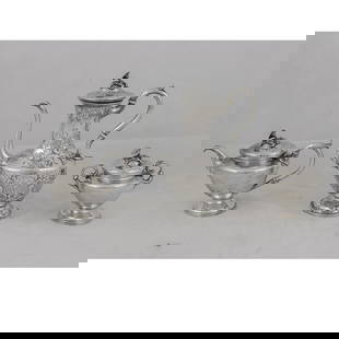A three piece sterling silver hollowware service: A three piece sterling silver hollowware service, each with floral finial, comprising repousse hot beverage pot marked 'Bailey and Co. Philadelphia', and engraved to base 'presented to Eugena C. Frost