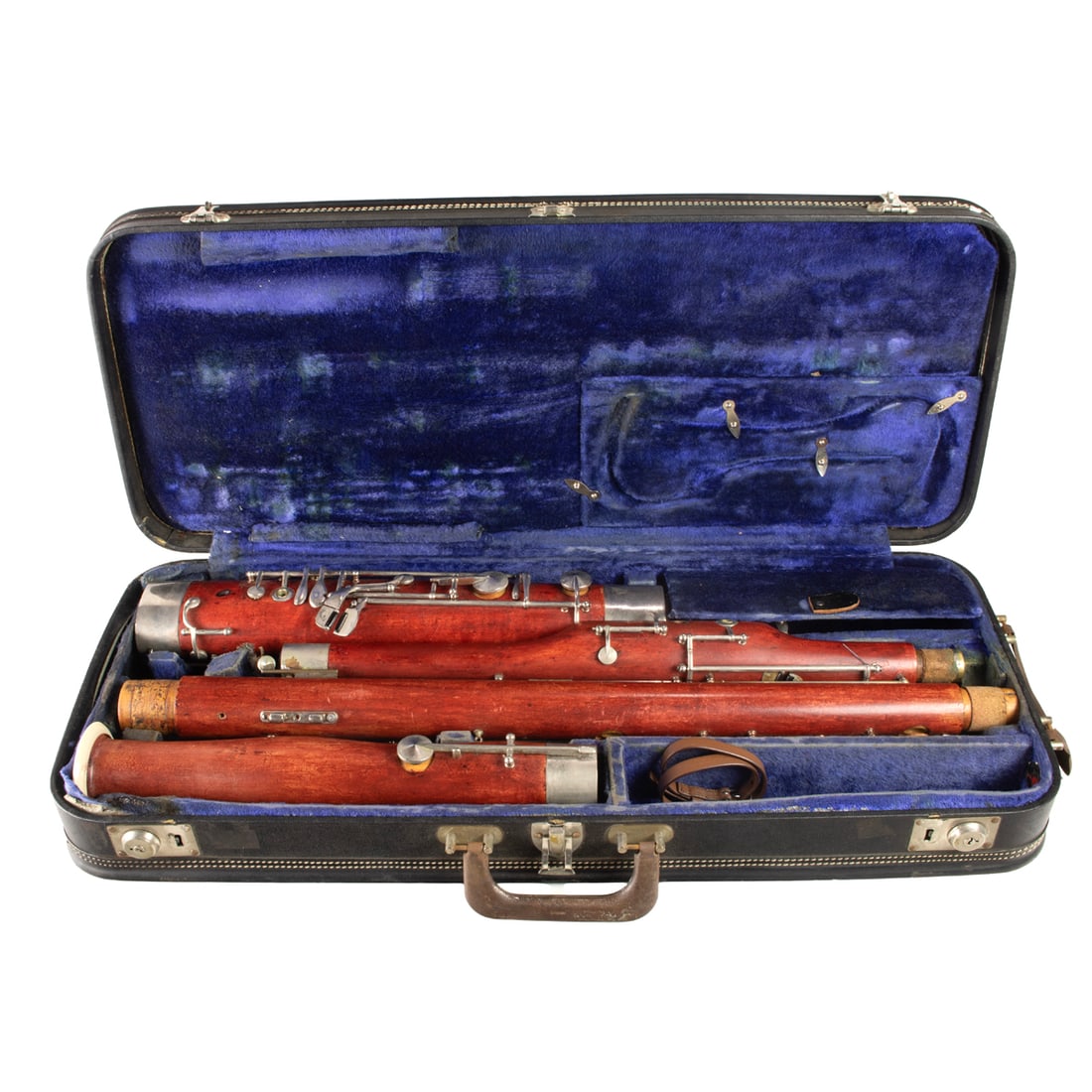 A Schreiber & Suhne wood bassoon in case: A Schreiber & Suhne wood bassoon in case, unmarked other than the case, case 4.5"h x 27.5"w x 11"d