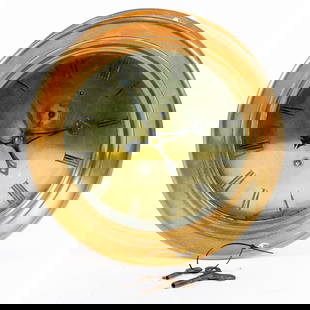 A brass ship's clock: A brass ship's clock, with brass Roman numeral dial, and Arabic subsidiary dial, unmarked, 8.25"dia (dial); 10.75"dia x 3.75"d (overall)