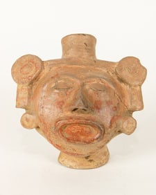 A Colima effigy face pot with spout