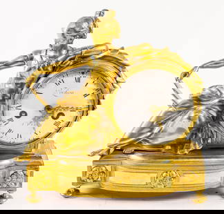 A Louis XVI style gilt bronze figural mantel clock: A Louis XVI style gilt bronze figural mantel clock, Pouchon a Paris, late 19th century, modeled as a young woman reclining against a drum inset with Roman and Arabic numeral enamel dial inscribed 'Pou