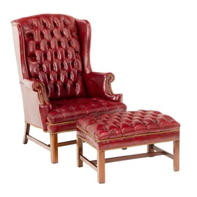 A Hickory Chair library chair and ottoman in tufted burgundy leather with nailhead trim
