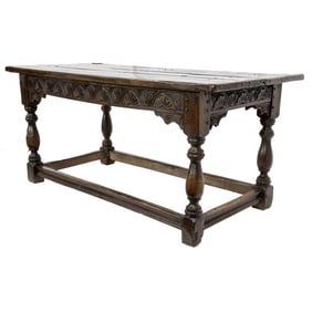 A Spanish Baroque carved oak plank table circa 1740