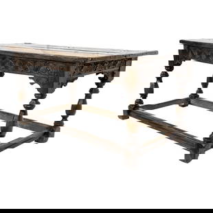 A Spanish Baroque carved oak plank table circa 1740: A Spanish Baroque carved oak plank table circa 1740, the five board top above the carved apron, and raised on turned legs conjoined with a box stretcher, 30"h x 65"w x 31"d