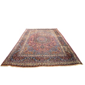 An antique Persian Mashad carpet