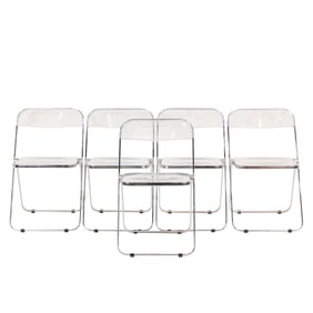 A set of five 'Plia' clear molded plastic and chrome plated steel folding chairs by Giancarlo