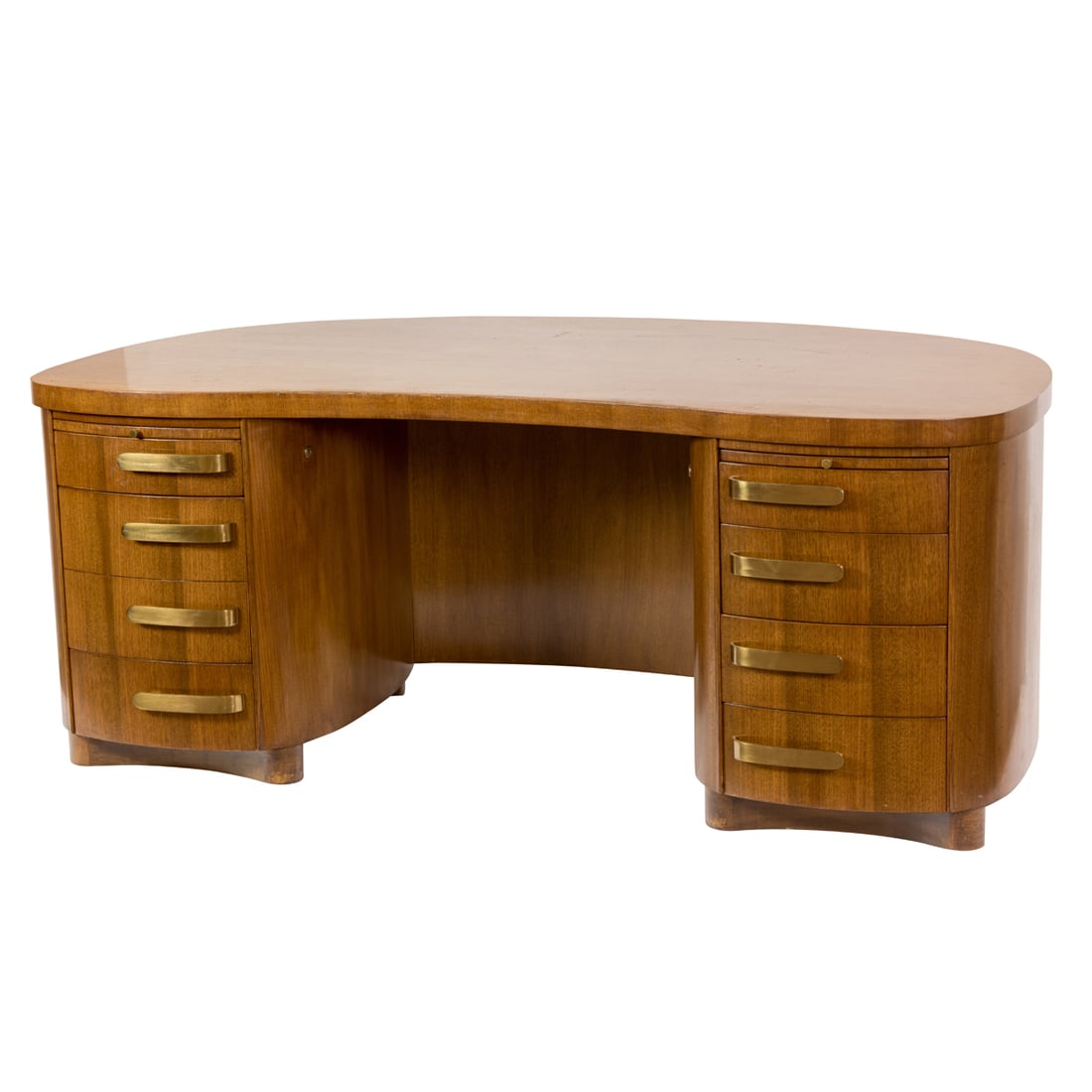 An Art Deco style kidney form executive desk by Stow & Davis, Hotel Hughson, Modesto, CA provenance: An Art Deco style kidney form executive desk by Stow & Davis, six drawers, with an additional drawer opening to file storage, two additional retractable writing surfaces. Metal label to drawer for Sto