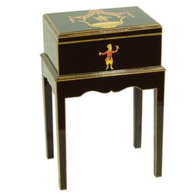 An Italian style decoupage decorated ebonized box on stand, Senator Feinstein Estate