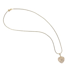 A diamond and 14k gold heart necklace