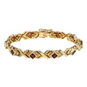 A garnet and 14k gold bracelet