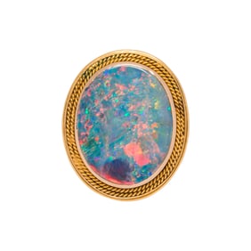 An opal and 14k gold ring