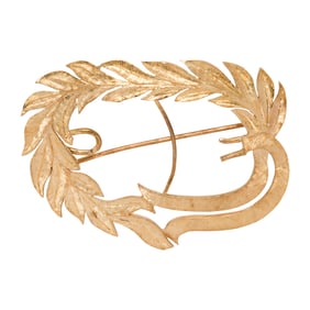 A 14k gold brooch
