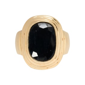 A sapphire and 18k gold ring