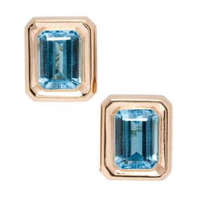 A pair of blue topaz and 14k gold earrings
