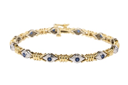 A sapphire and 14k bi-color gold bracelet