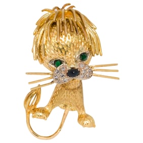 A diamond, sapphire, emerald and 18k gold lion brooch
