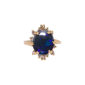 A black opal, diamond, and 14k gold ring