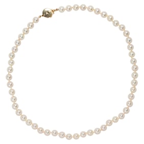A cultured pearl and 14k gold pearl necklace