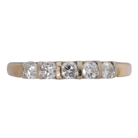 A diamond and 14k gold ring