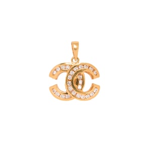 A diamond and 18k gold pendant
