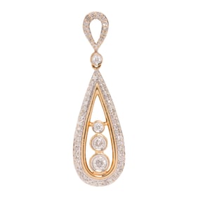 A diamond and 14k gold pendant
