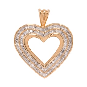 A diamond and 10k gold heart pendant