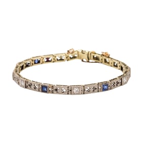 An art deco diamond, sapphire, and platinum-topped 14k gold bracelet