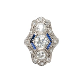 A sapphire, diamond and platinum ring