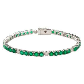An emerald, diamond, and 14k white gold bracelet