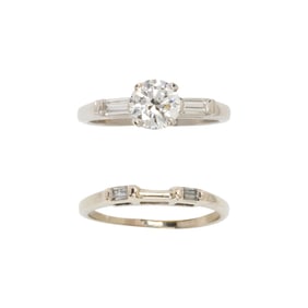 A diamond and 14k white gold wedding set