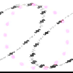 A ruby, diamond, and 14k white gold necklace: A ruby, diamond, and 14k white gold necklaceFeaturing 17 oval and pear-cut rubies, interspersed by trillion and oval-cut diamonds; estimated total ruby weight: 36.8 carats; estimated total diamond wei