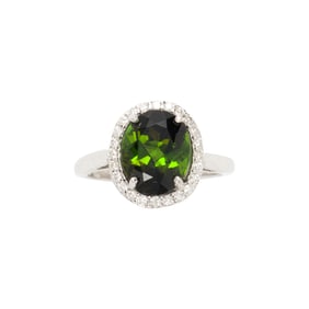 A peridot, diamond, and 14k white gold ring