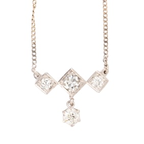 A diamond and 14k white gold necklace