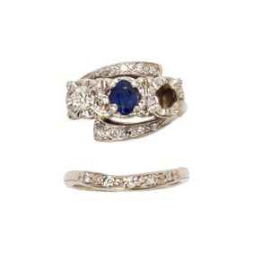 A sapphire diamond and 14k white gold wedding set