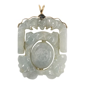 A jade and 14k gold hinged pendant
