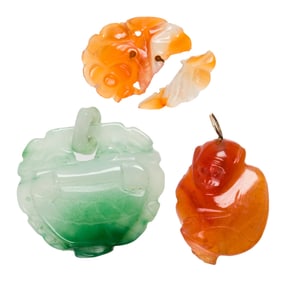 Three carved jade pendants