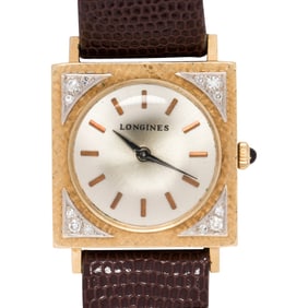 A Longines 14k gold watch