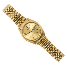 A Seiko gold tone stainless steel watch
