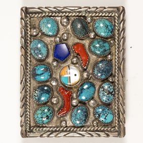 A Native American turquoise, coral, lapis lazuli, mother of pearl, and silver belt buckle