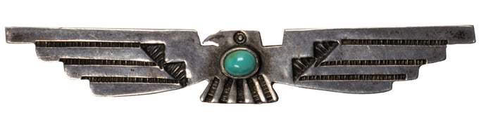 A Native American silver and turquoise pin