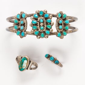 A group of silver and turquoise childrens jewelry