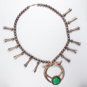 A Native American green turquoise and silver necklace