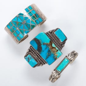 A group of three Native American turquoise and silver cuffs