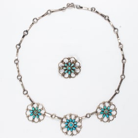 A Native American turquoise and silver necklace and pin