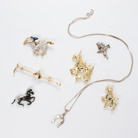 A group of horse jewelry
