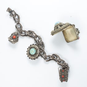 A silver and gemstone charm bracelet