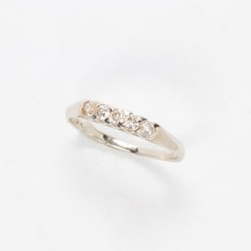 A diamond and 14k white gold ring