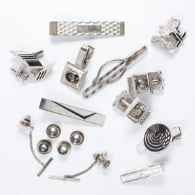 A group of silver tone men's accessories