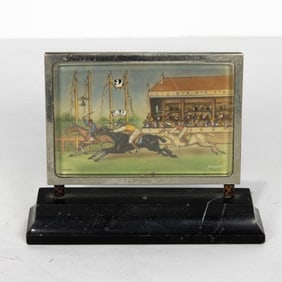 An Art Deco analog Swiss horse racing clock, enameled dial depicting a finish line, the dial is