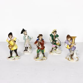 A five piece German Volkstedt porcelain monkey band in the Meissen style